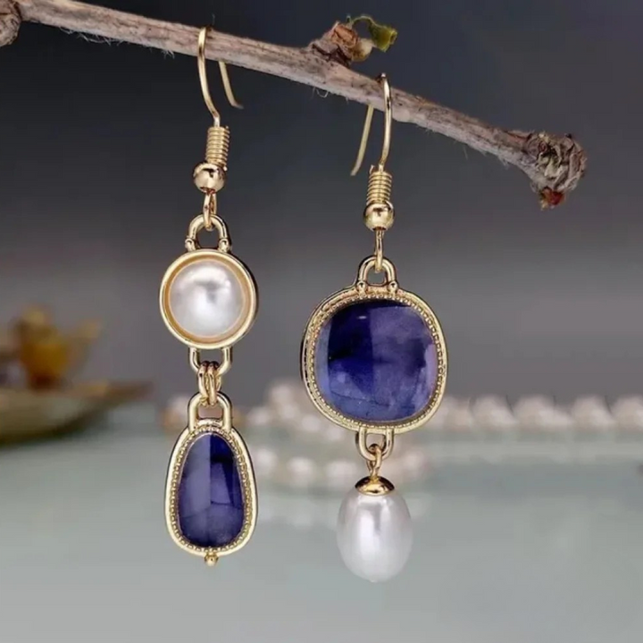 Pendientes elegantes con una piedra azul y una perla - Zelira